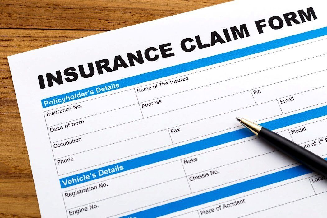 Blank Insurance Claim Form and a Pen — Chicago, IL — Illinois Insurance Center