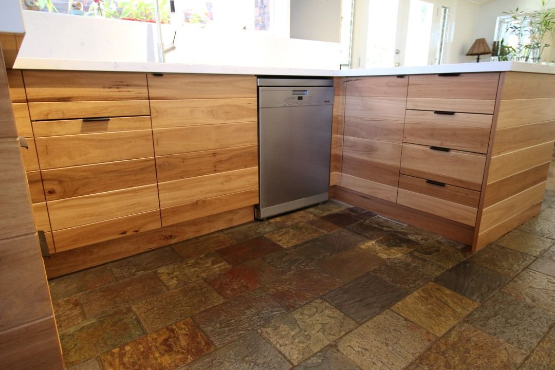 A Kitchen With Wooden Cabinets and a Stainless Steel Dishwasher — High Kraft Kitchens and Joinery in Berkeley, NSW