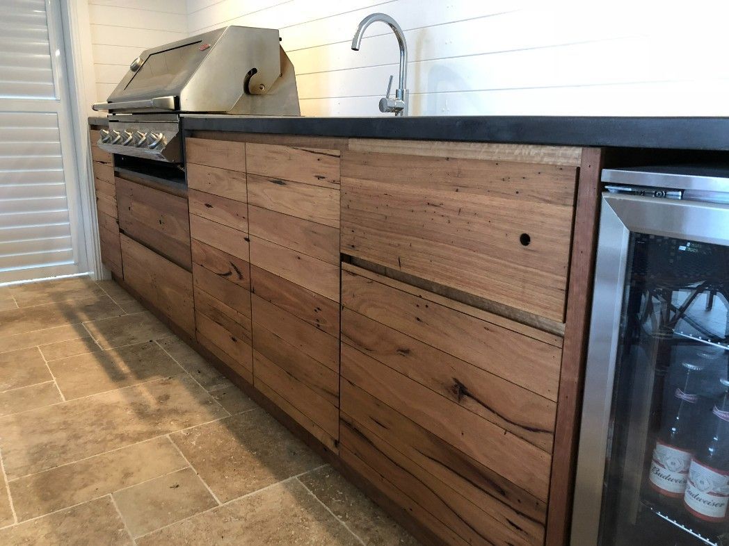 A Kitchen With Wooden Cabinets and a Stainless Steel Refrigerator — High Kraft Kitchens and Joinery in Thirroul, NSW