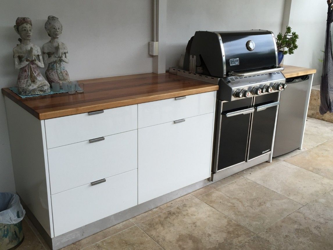 A Black Grill is Sitting on Top of a Wooden Counter — High Kraft Kitchens and Joinery in Berkeley, NSW