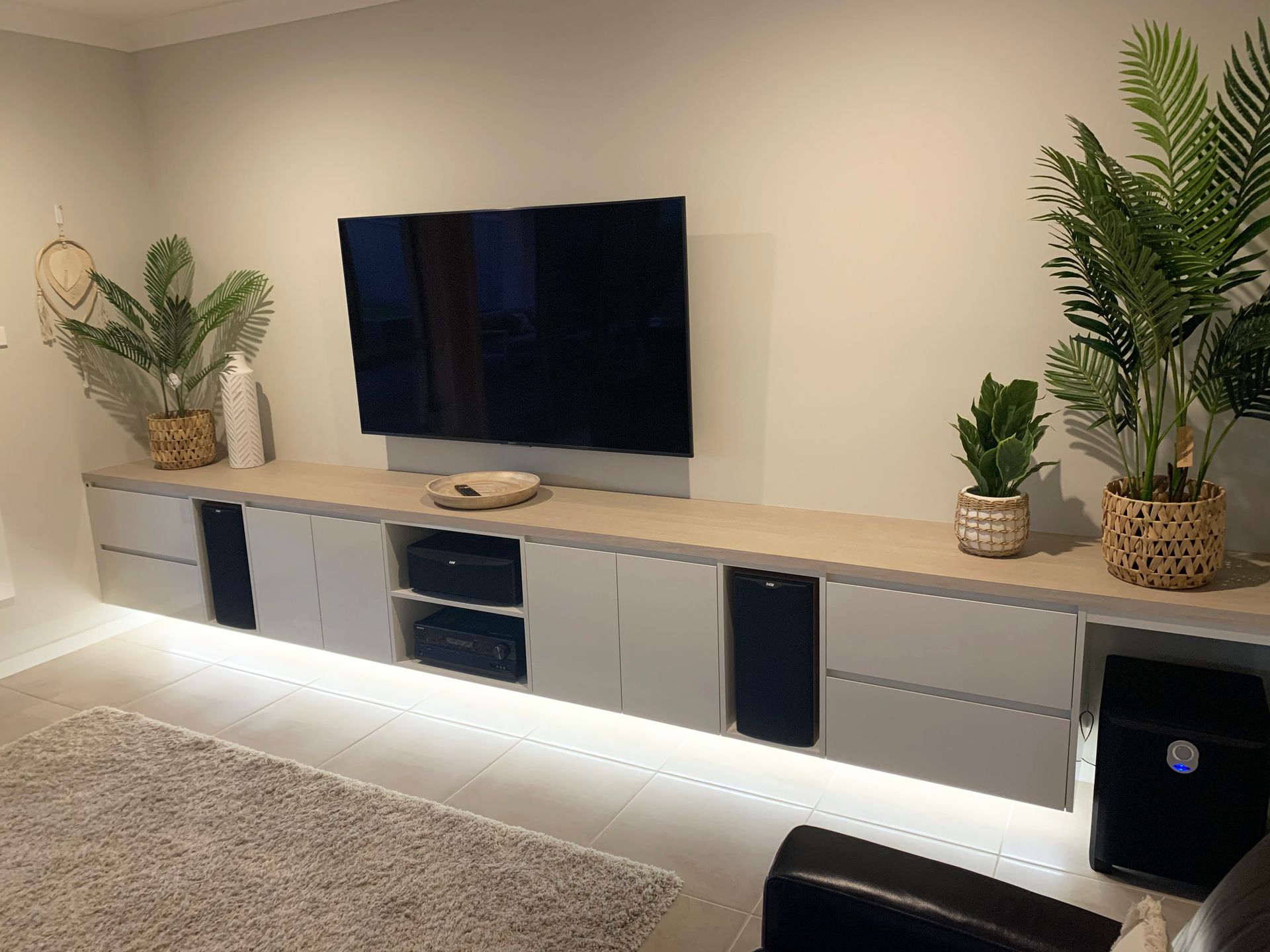 A Living Room With Wall Cabinet and a Flat Screen TV — High Kraft Kitchens and Joinery in Berkeley, NSW