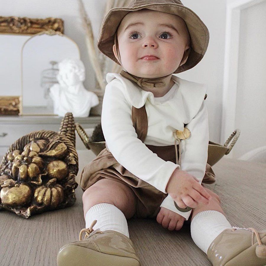 A Baby Wearing a Hat - Saint Georges, DE - Chavies Boutique