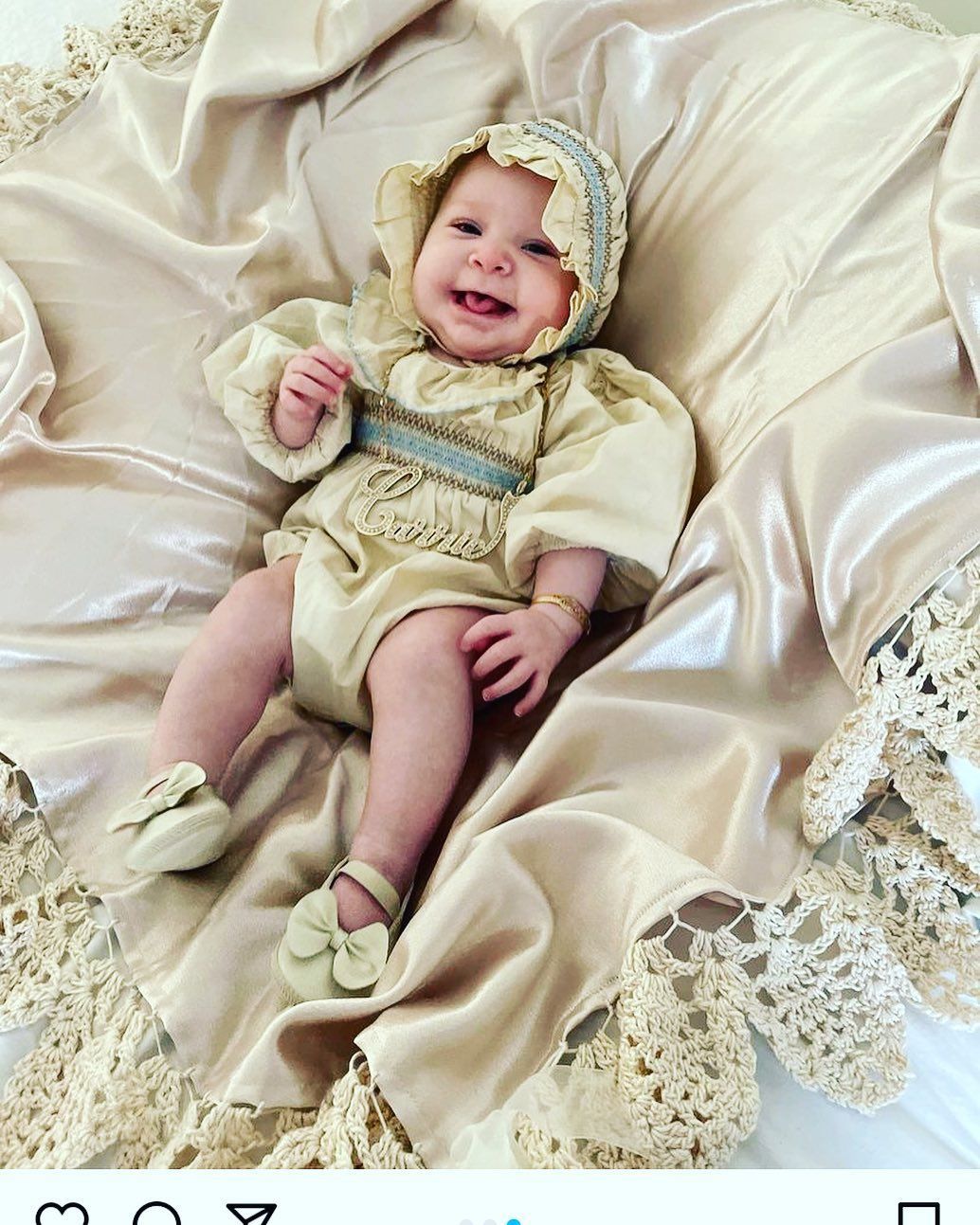 A Baby Is Lying on A Bed with A Blanket - Saint Georges, DE - Chavies Boutique