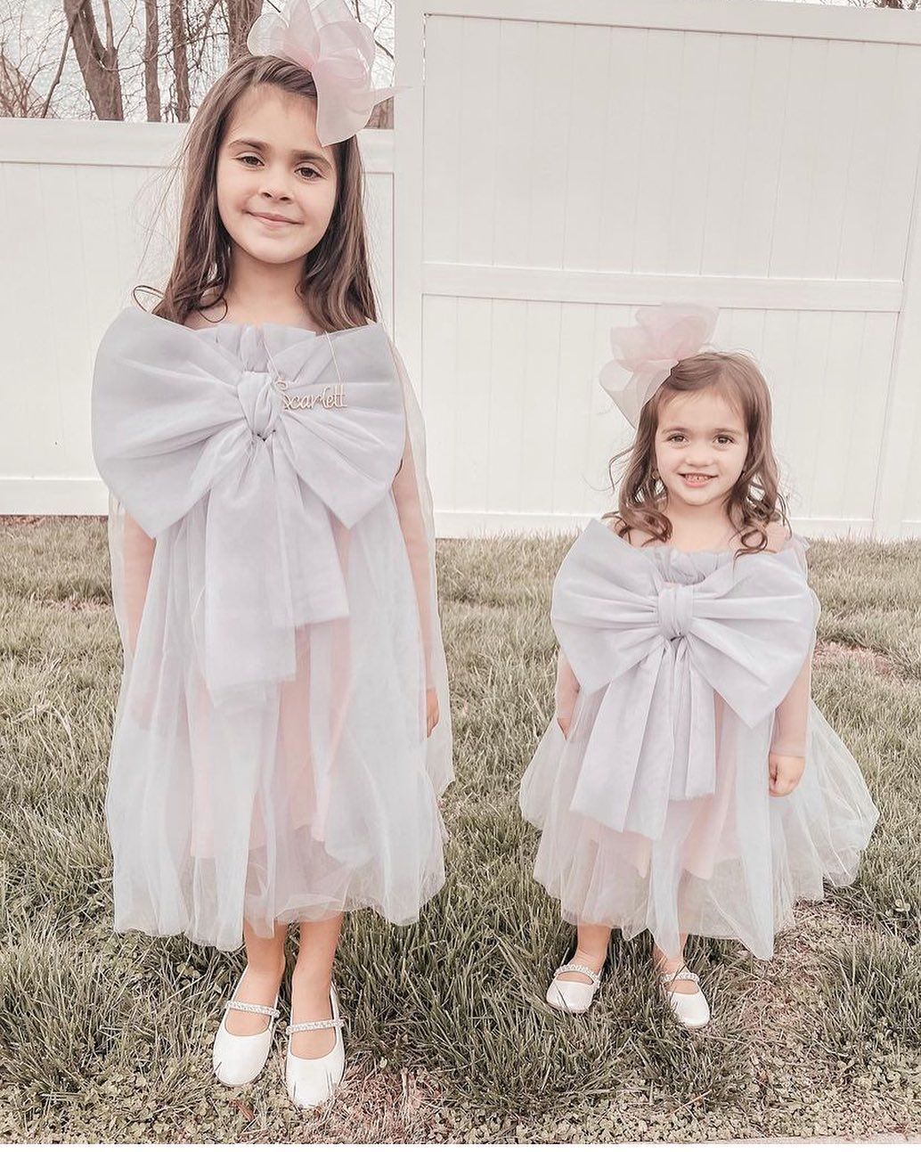 Two Little Girls Are Wearing Matching Dresses - Saint Georges, DE - Chavies Boutique
