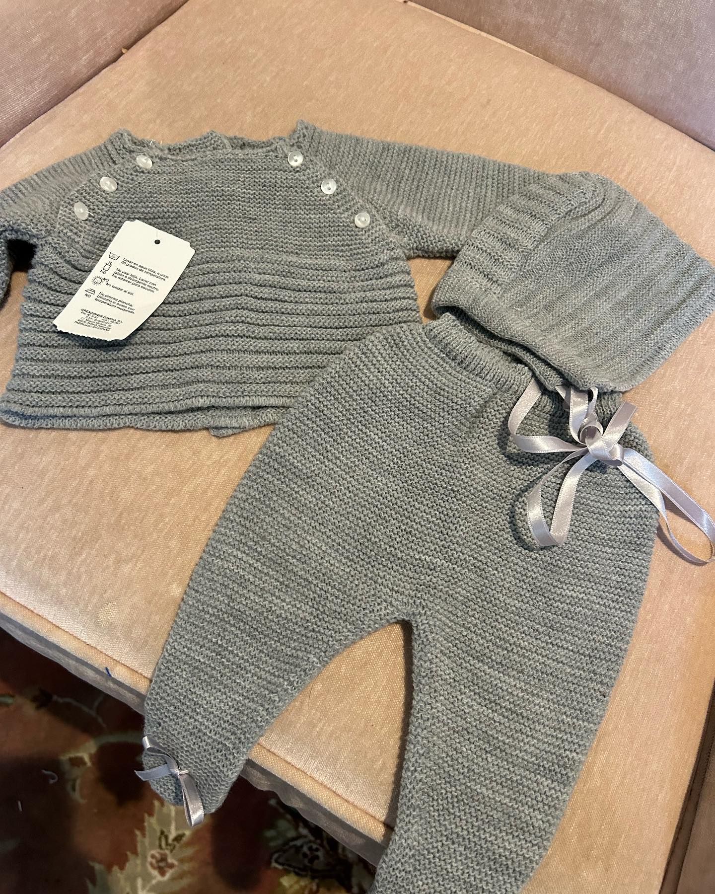 A Baby 's Sweater and Pants Are Sitting on A Couch - Saint Georges, DE - Chavies Boutique