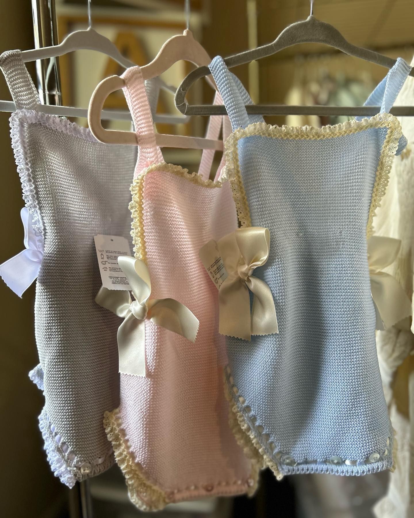 Three Baby Clothes Are Hanging on A Rack - Saint Georges, DE - Chavies Boutique