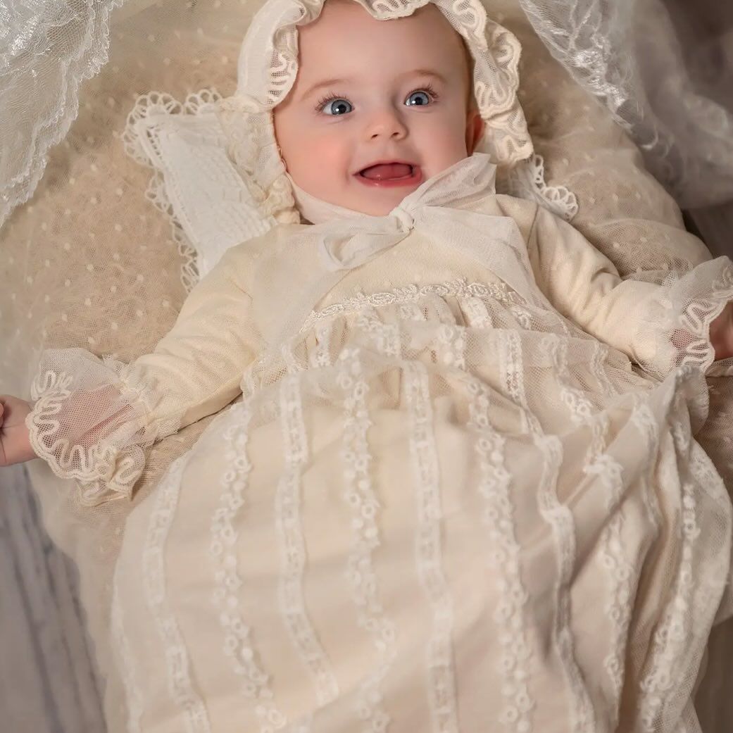 A Baby Is Wearing a White Lace Dress - Saint Georges, DE - Chavies Boutique