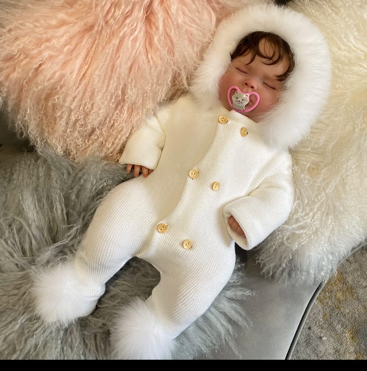A Baby Wearing a White Snow Suit - Saint Georges, DE - Chavies Boutique