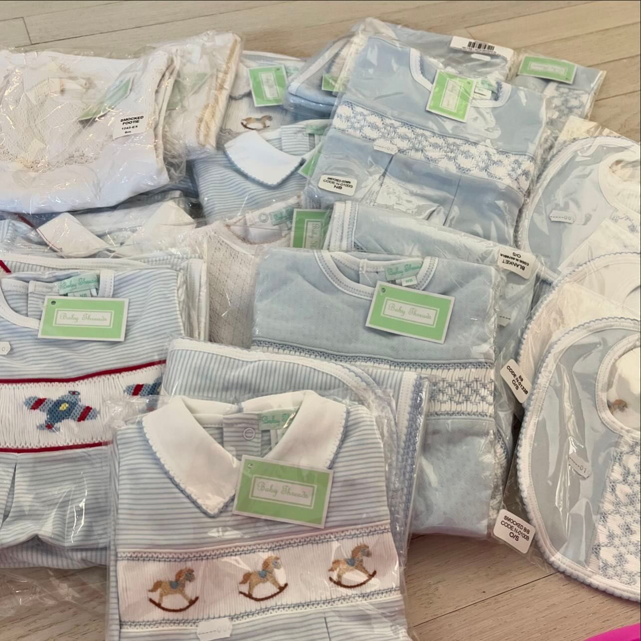 A Bunch of Baby Clothes Are Stacked on Top of Each Other - Saint Georges, DE - Chavies Boutique