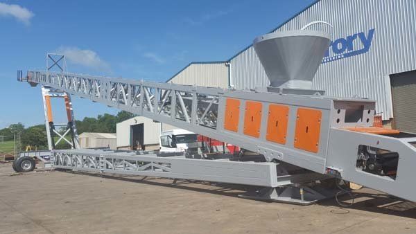 grey and orange wheel conveyor