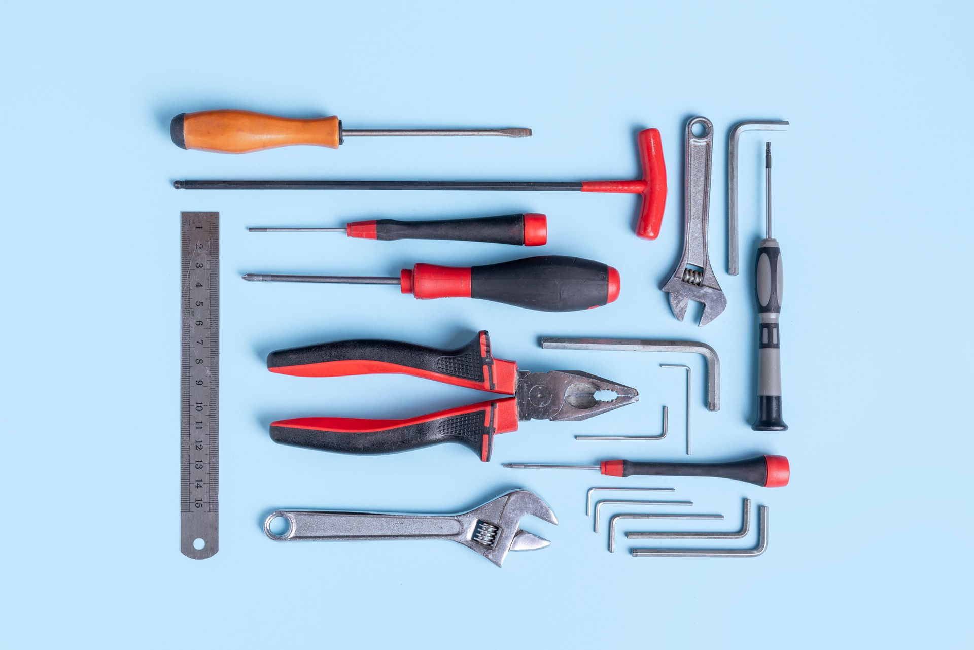 Working Tools Arranged On Blue Background