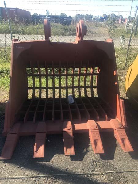 red excavator bucket with grate