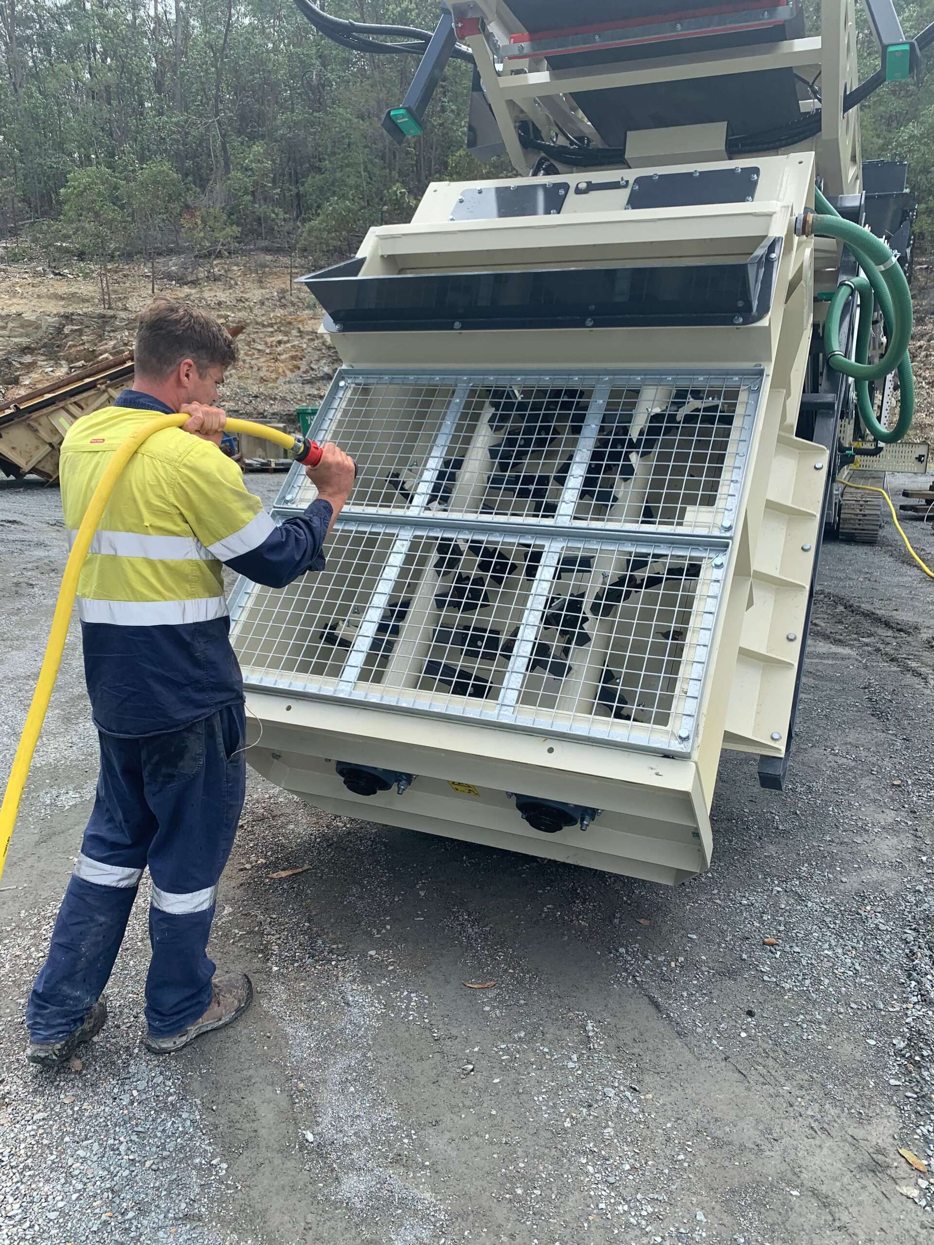 Worker using truck pugmill