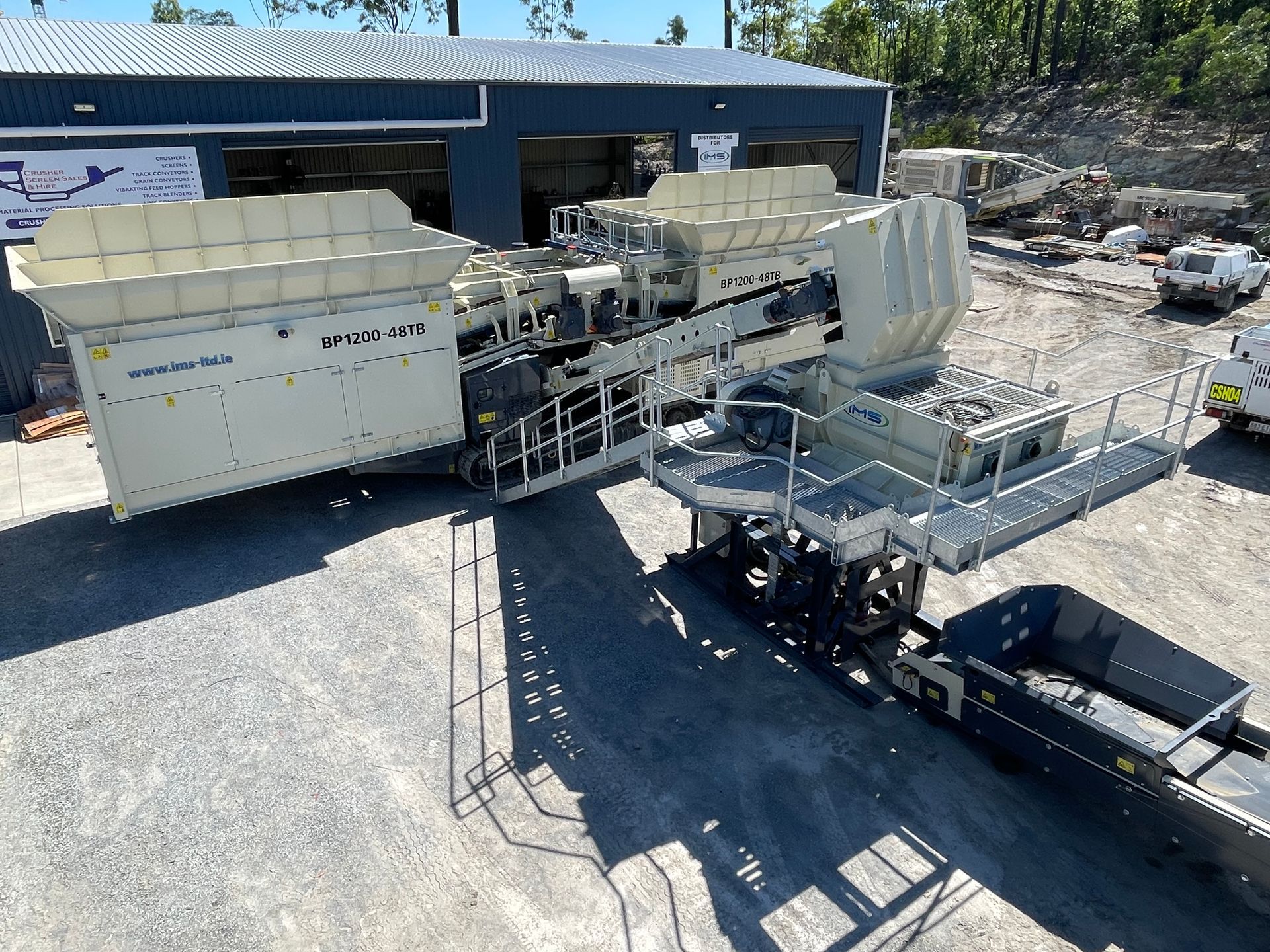 A Large Machine Is Parked In Front Of A Building — Yatala Qld — Crusher Screen Sales & Hire