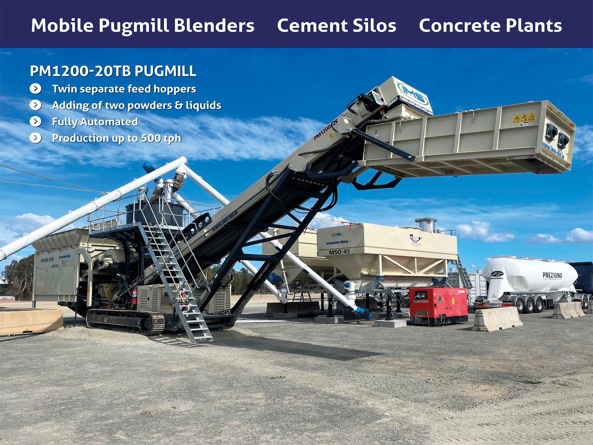 Mobile pugmill with conveyor and cement silos in an outdoor construction site.