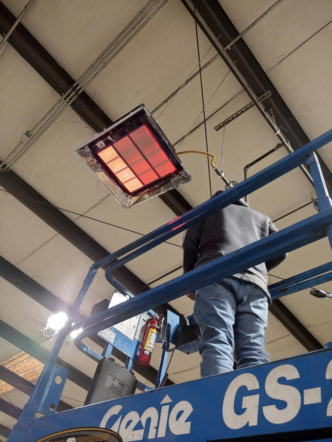 Man Installing Heater — Townville, SC — Andy’s HVAC Service LLC