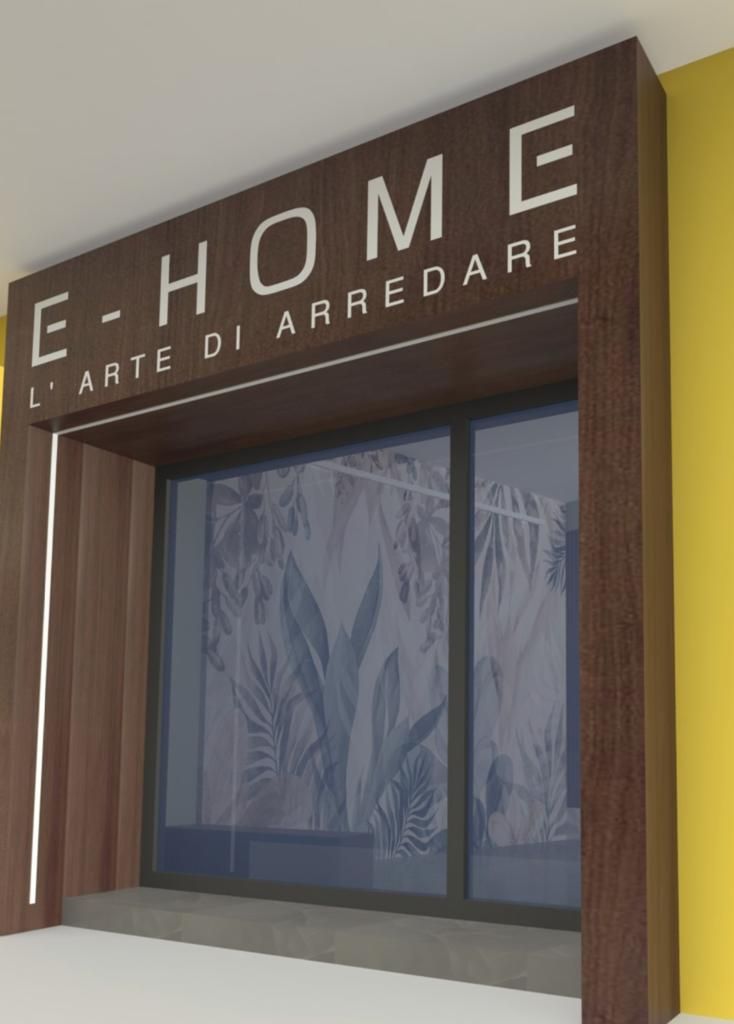 Sopra un'ampia vetrina, con un interno decorato con motivi a foglie, si trova un'insegna in legno scuro con la scritta