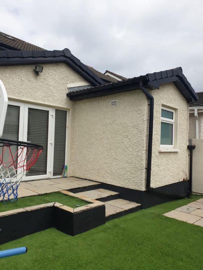 A house with a basketball hoop in front of it