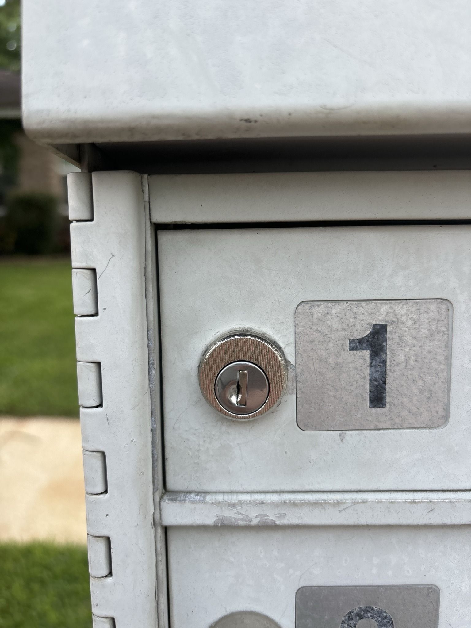 A white mailbox with the number 1 on it