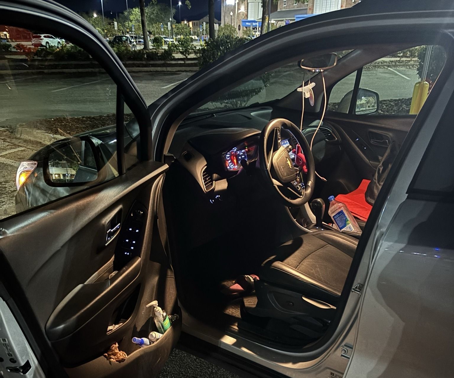 The inside of a car with the door open