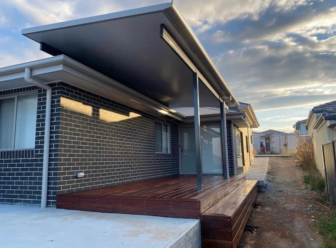Modern Home Exterior With a Dark-colored Deck and Awning — Northco Constructions In Muirhead, NT