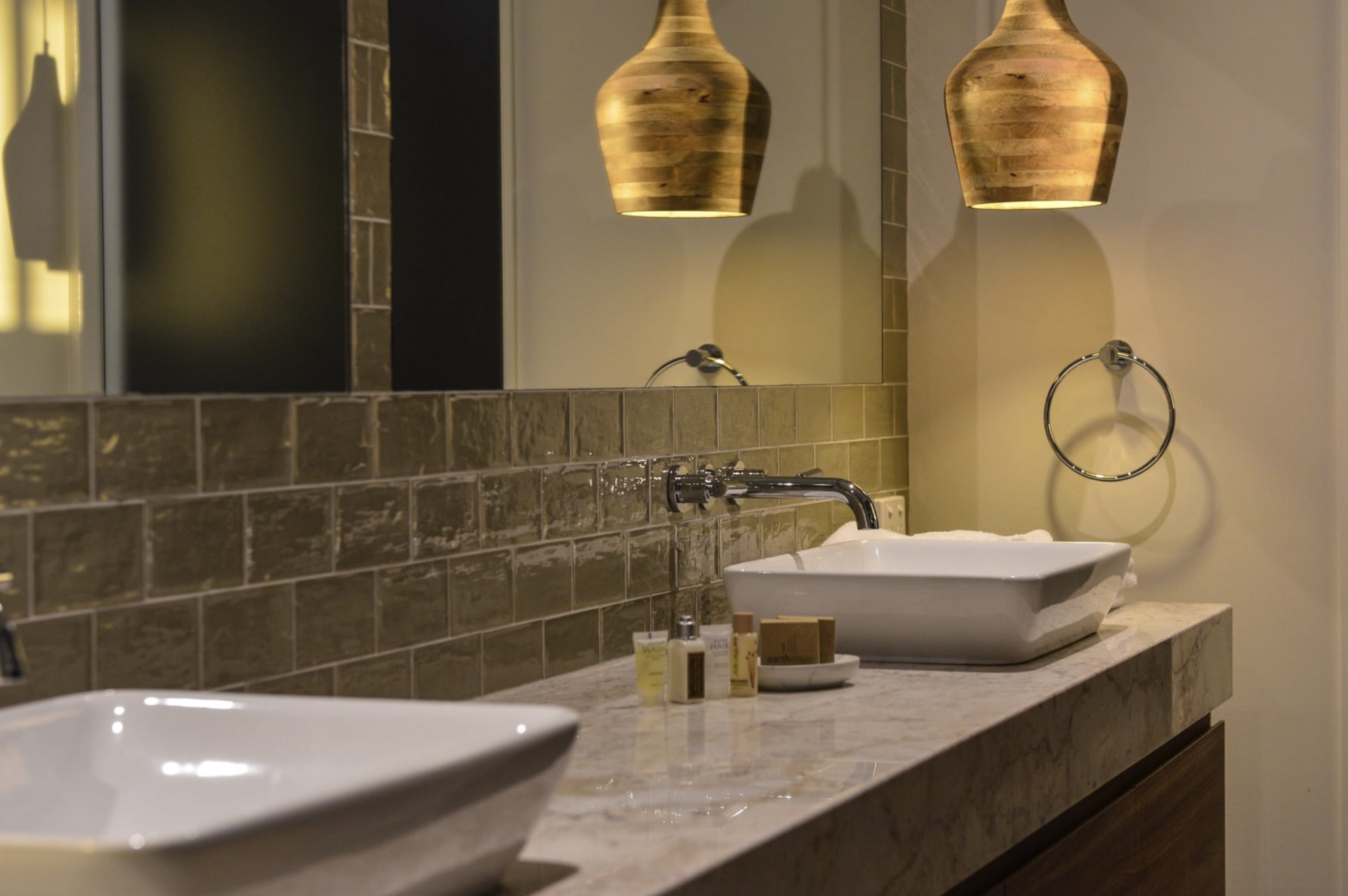 Man Cutting Wood with A Circular Saw, Wearing Safety Glasses and A Tool Belt, Indoor Setting — Northco Constructions In Muirhead, NT