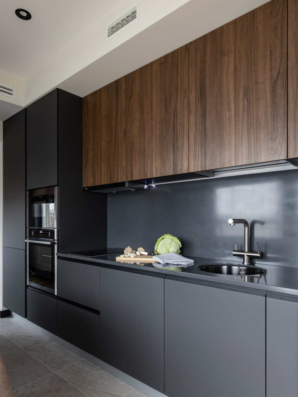 Man Cutting Wood with A Circular Saw, Wearing Safety Glasses and A Tool Belt, Indoor Setting — Northco Constructions In Muirhead, NT