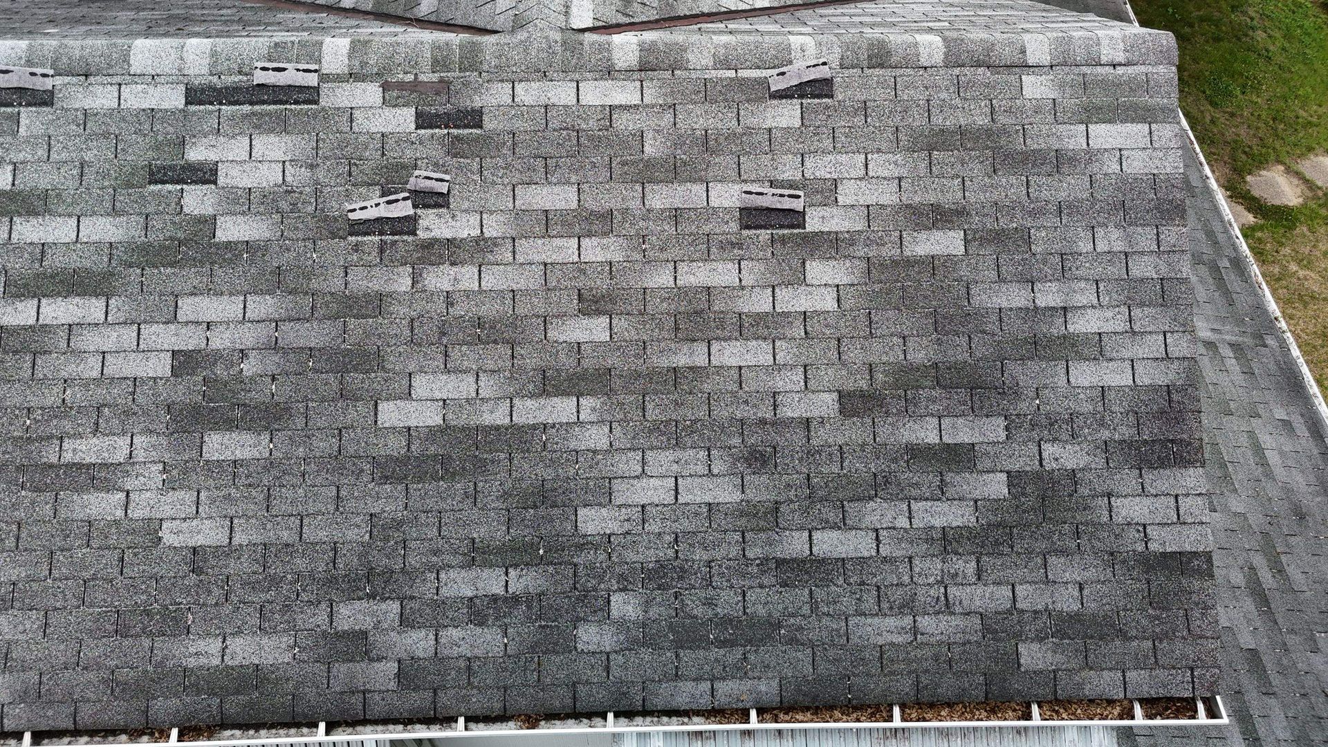 An aerial view of a roof with a lot of shingles on it.