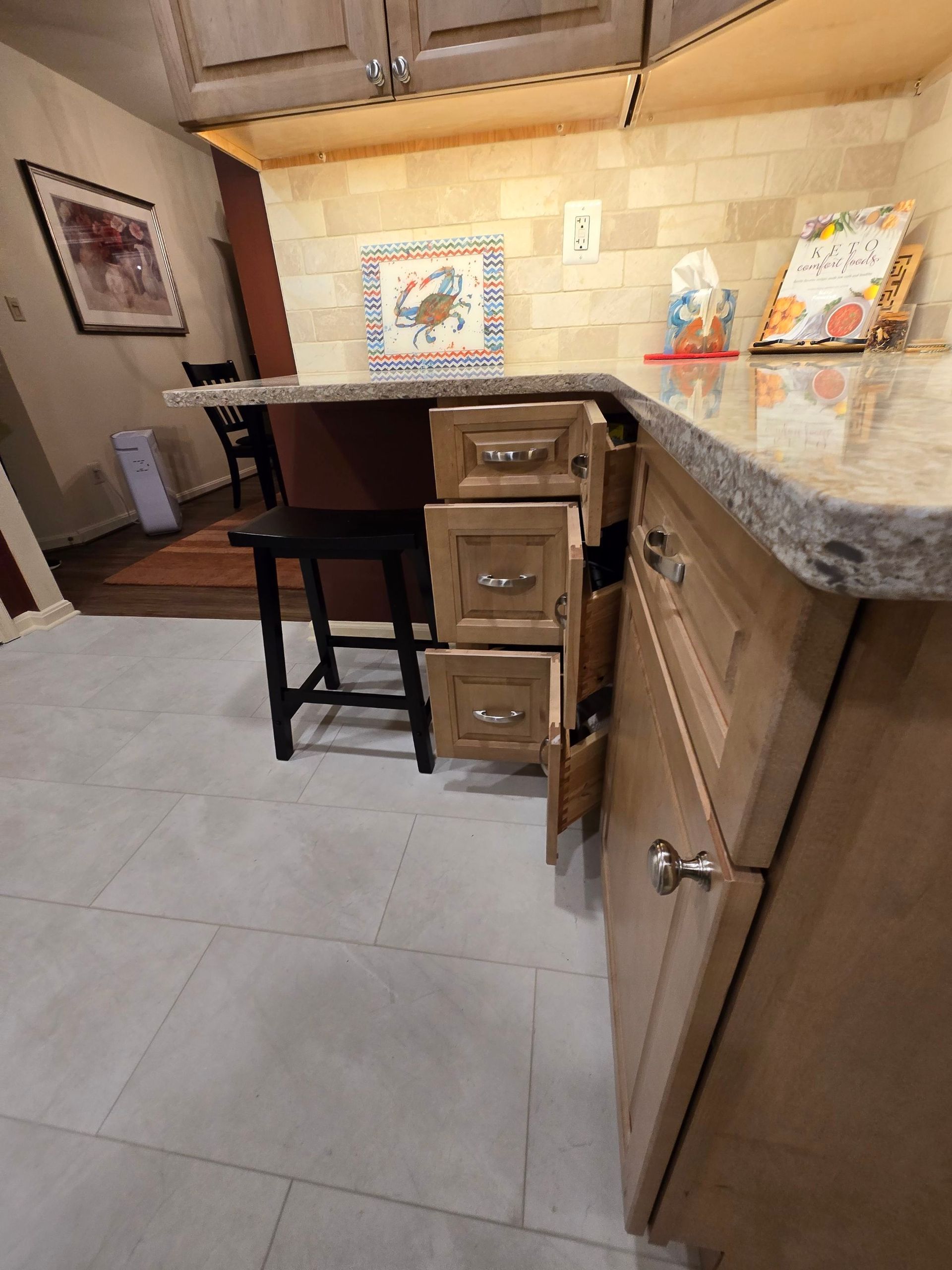A kitchen with a large island and lots of drawers
