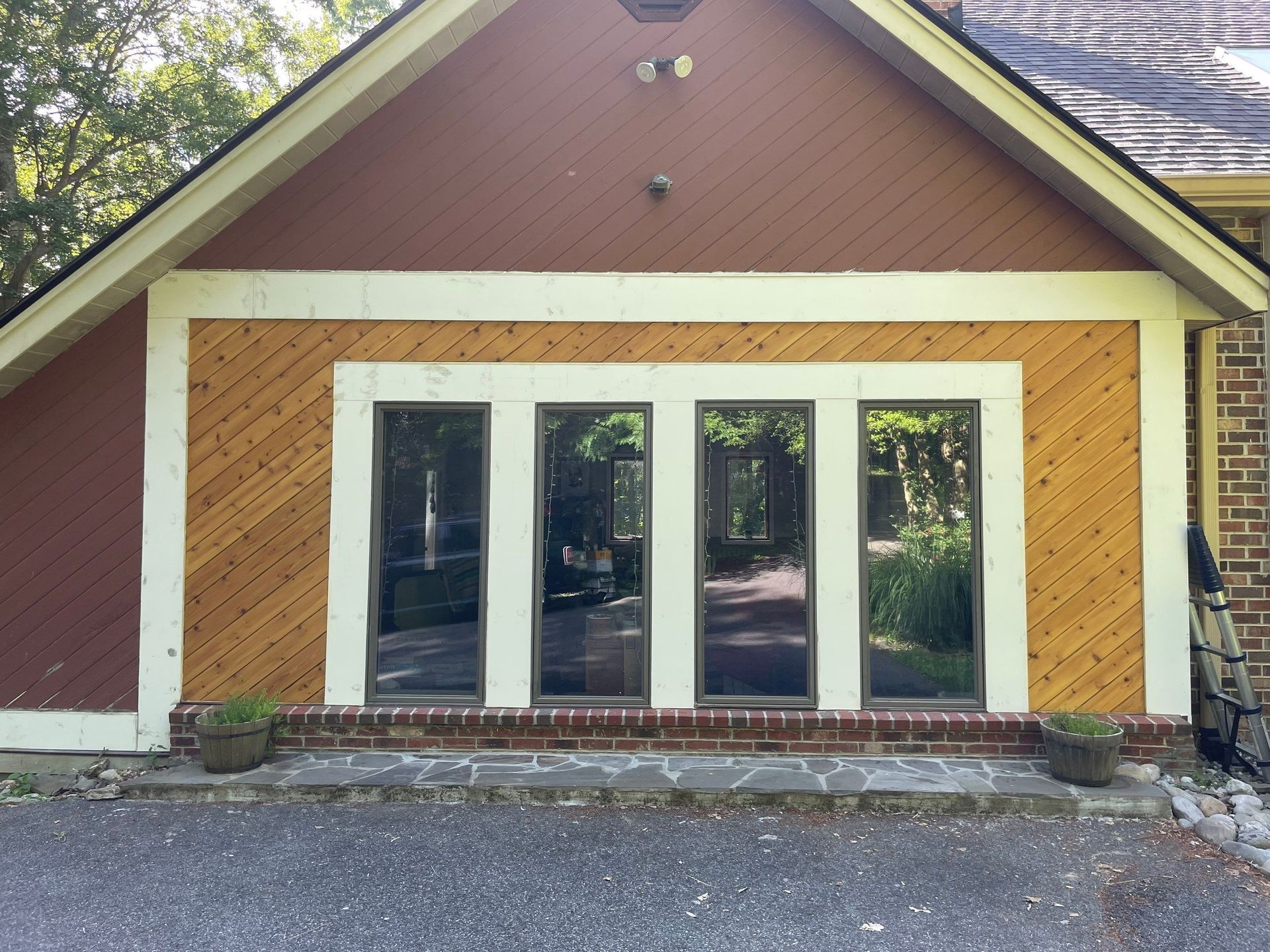 The front of a house with a lot of windows