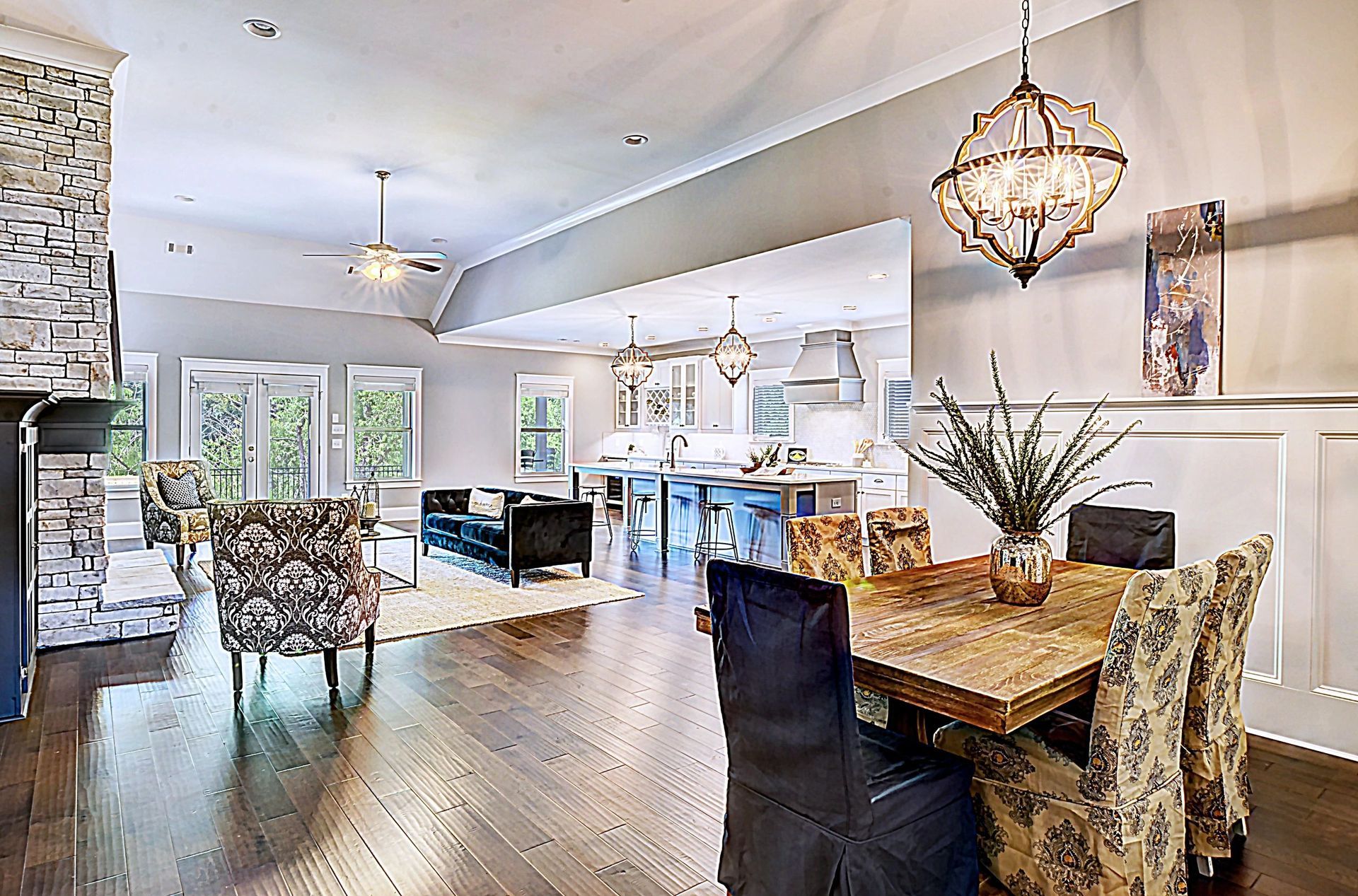 There is a dining table and chairs in the middle of the room.