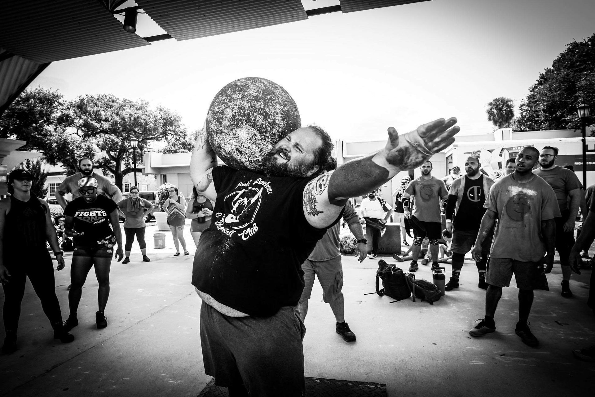 Strong Man Lifting A Big Tire — St. Augustine, FL — Amp Hardcore Gym