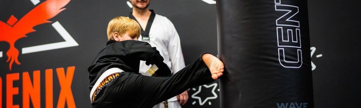 a child kicking a mat bag