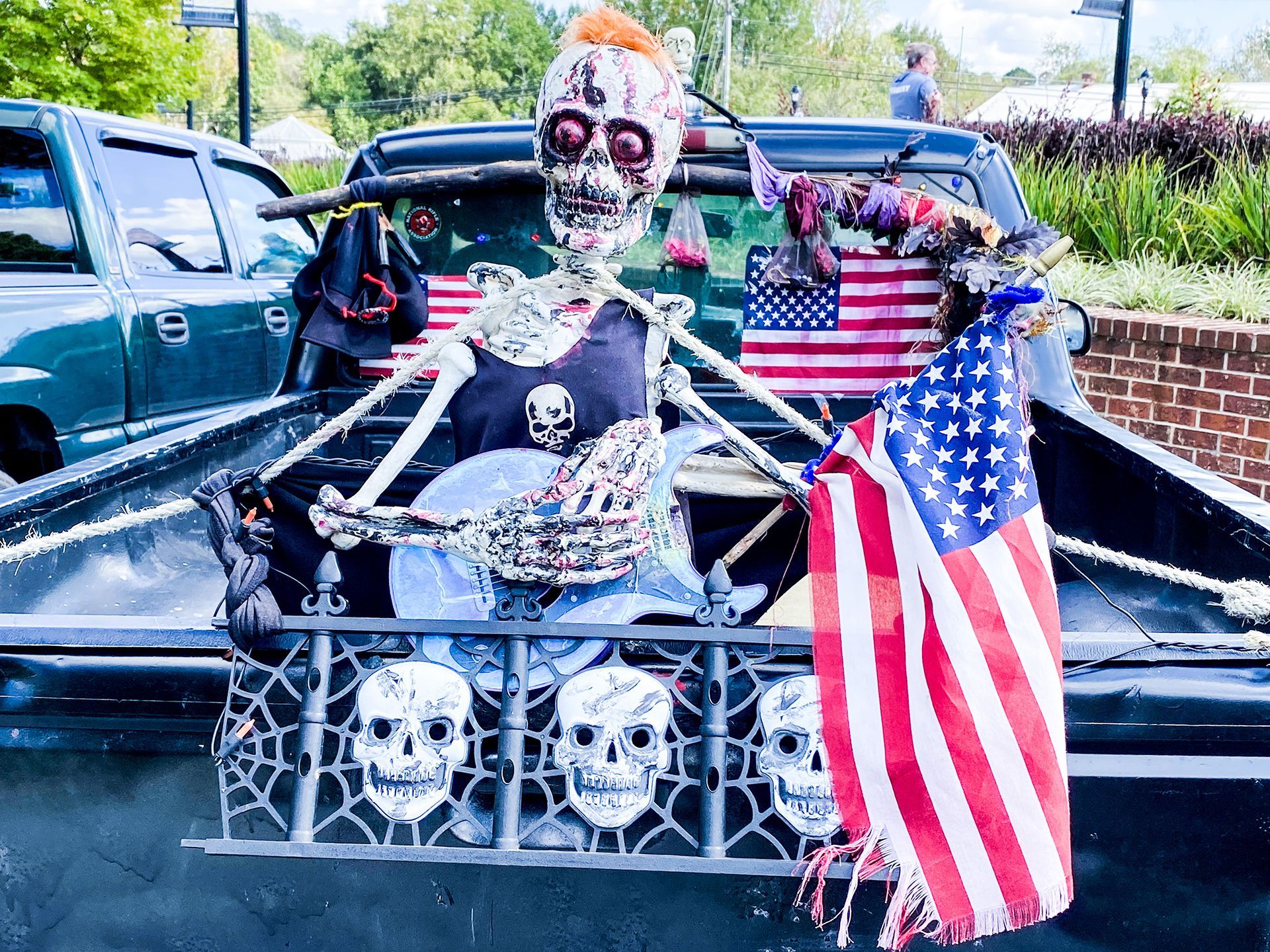 A group of people are posing for a picture with their arms in the air.