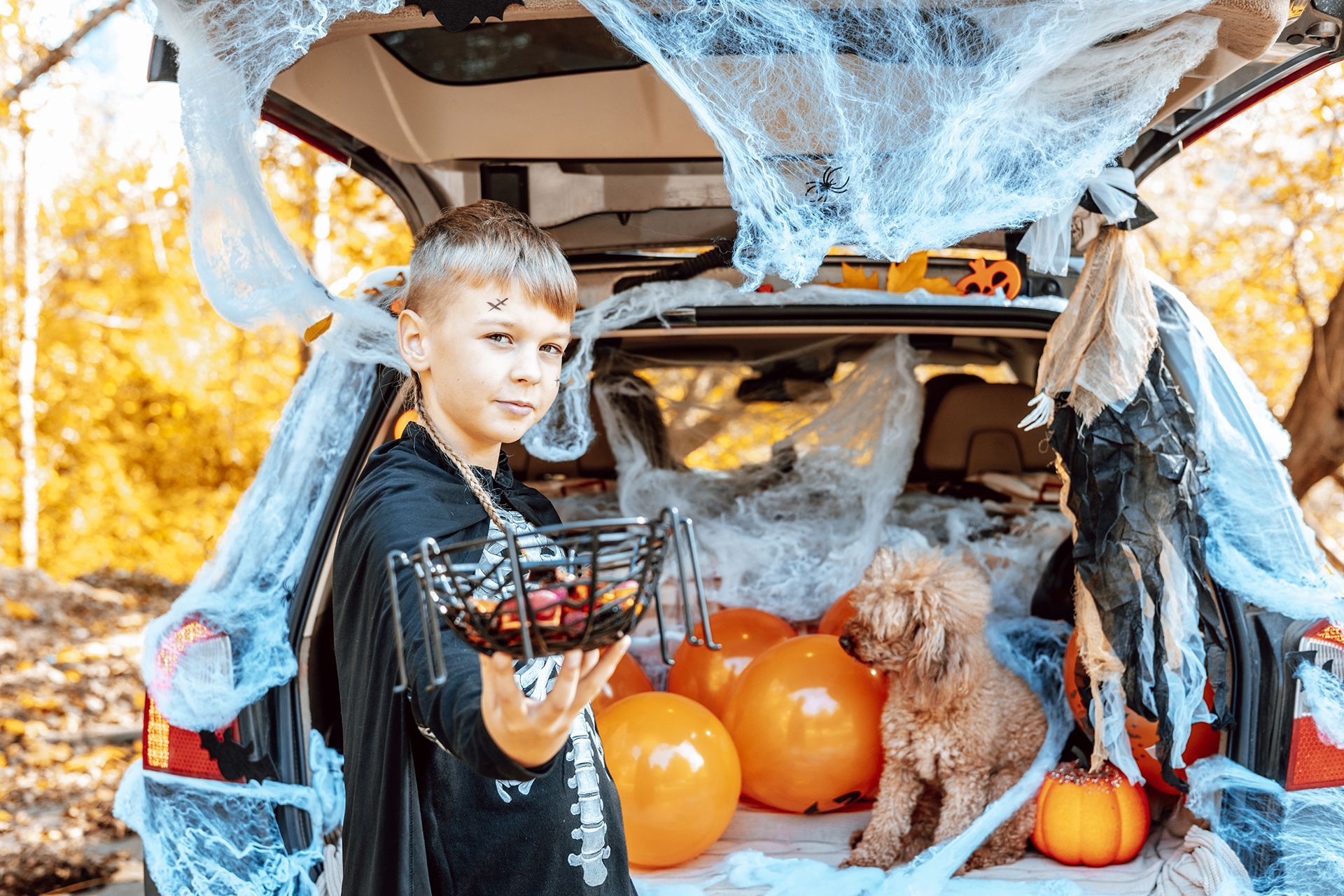 A man and a woman are wrestling on a mat in a gym.