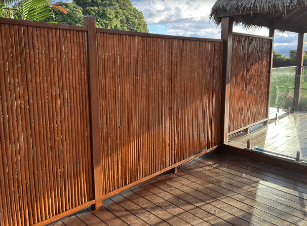 A Man Is Painting A Wall Blue In A Room — Tweed Heads Painting Service In Condong, NSW