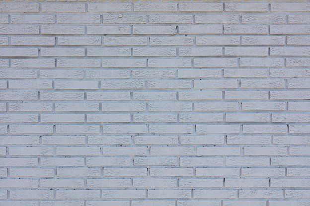 A close up of a white brick wall | Siefken Roofing and Remodeling Services in Omaha, NE