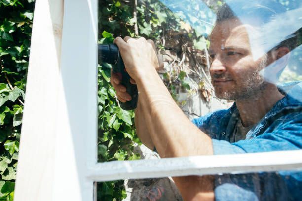 A man is installing a new window.