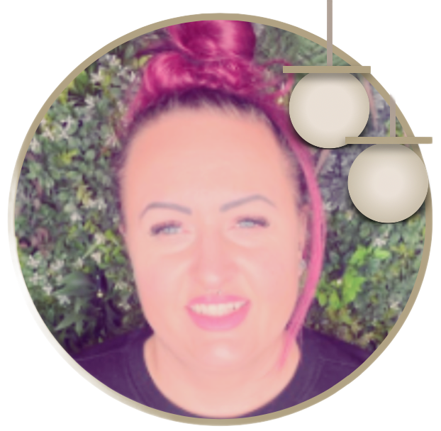 A woman with pink hair is smiling in a circle