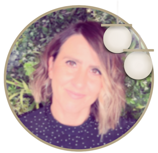 A woman in a polka dot shirt is smiling in a circle