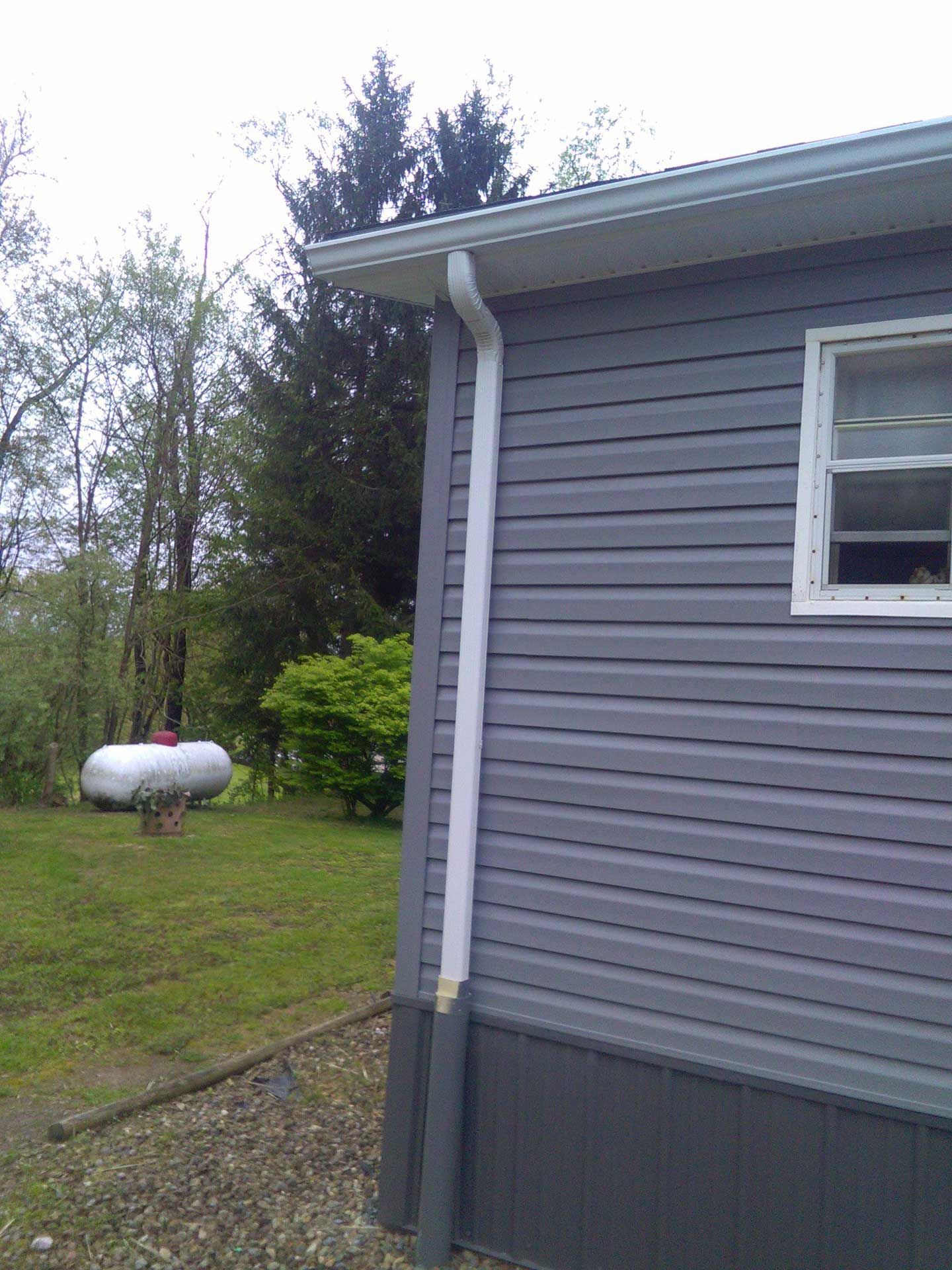 house with white gutter installed 1