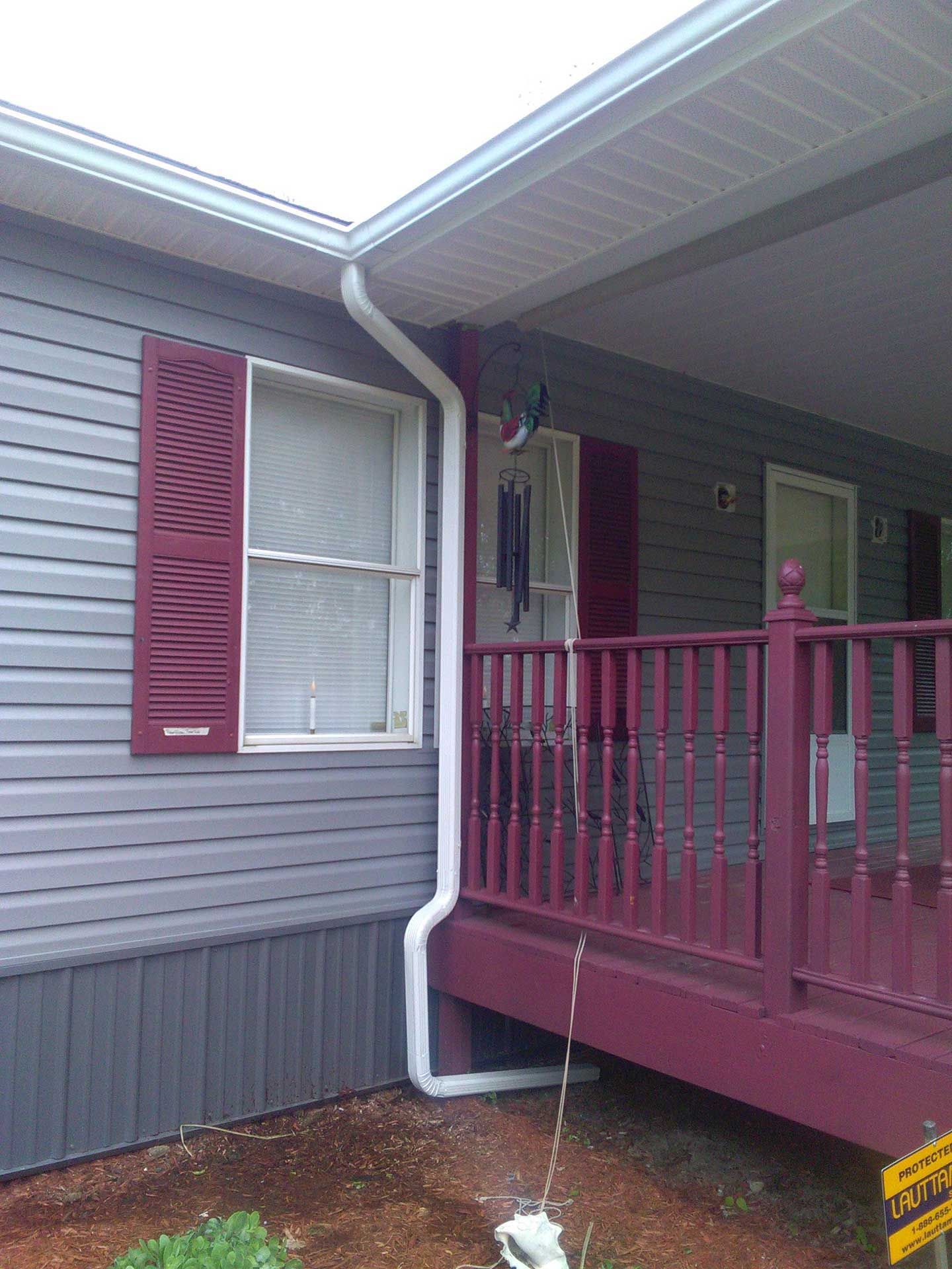 house with white gutter installed 2