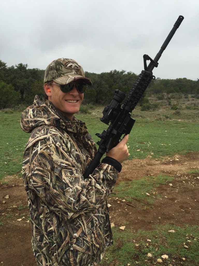 Smiling Guy Holding Gun