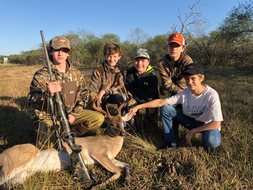 Group of People Posing With Trophy Deer
