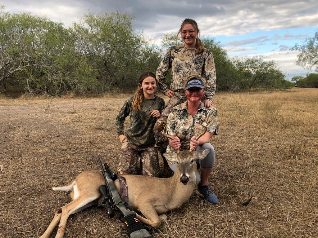 Family Posing with Trophy Deer