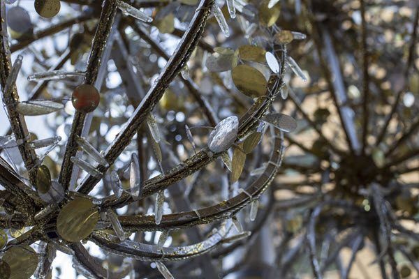 A close up of a chandelier with ice on it.