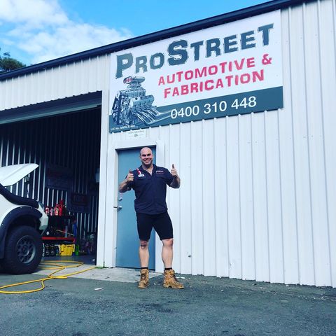 Man Standing at Car Repair Shop — Mechanics in Newcastle, NSW