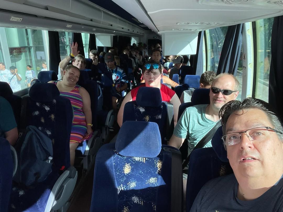 A group of people are sitting on a bus.