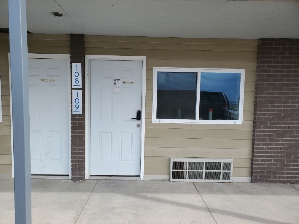 A white door with the number 108 on it