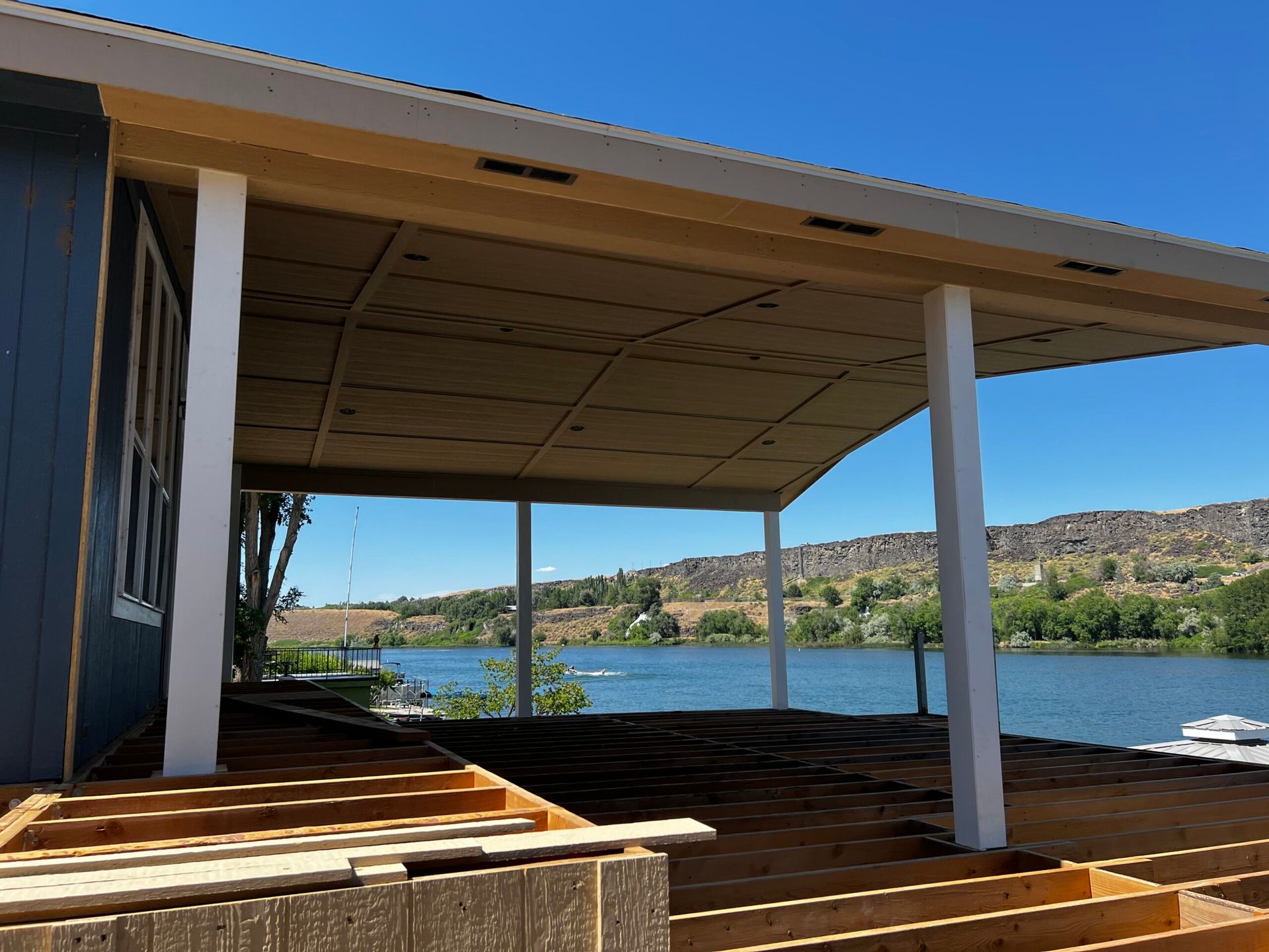 A house under construction with a view of a lake
